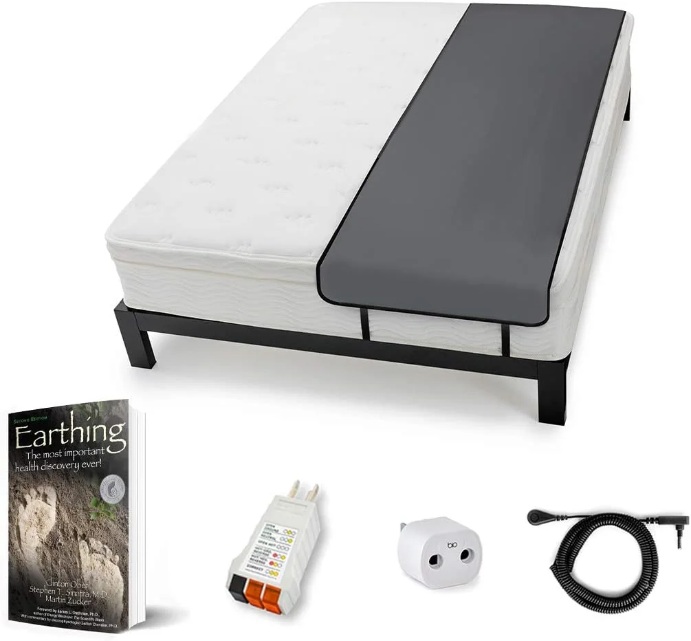 Earthing sleep mat kit: a black conductive sleep mat on a bed with its coil cord, safety adapter, outlet checker and the Earthing book.