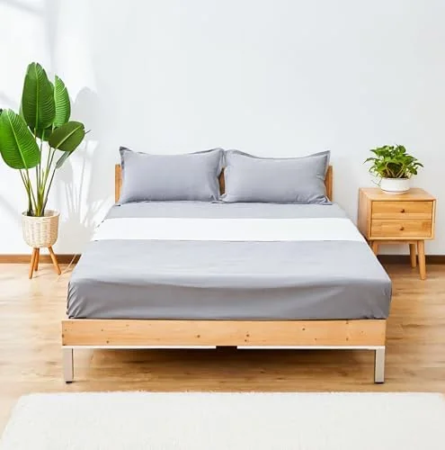 GroundingWell grounding sheet: a light grey conductive sheet fitted across a bed.